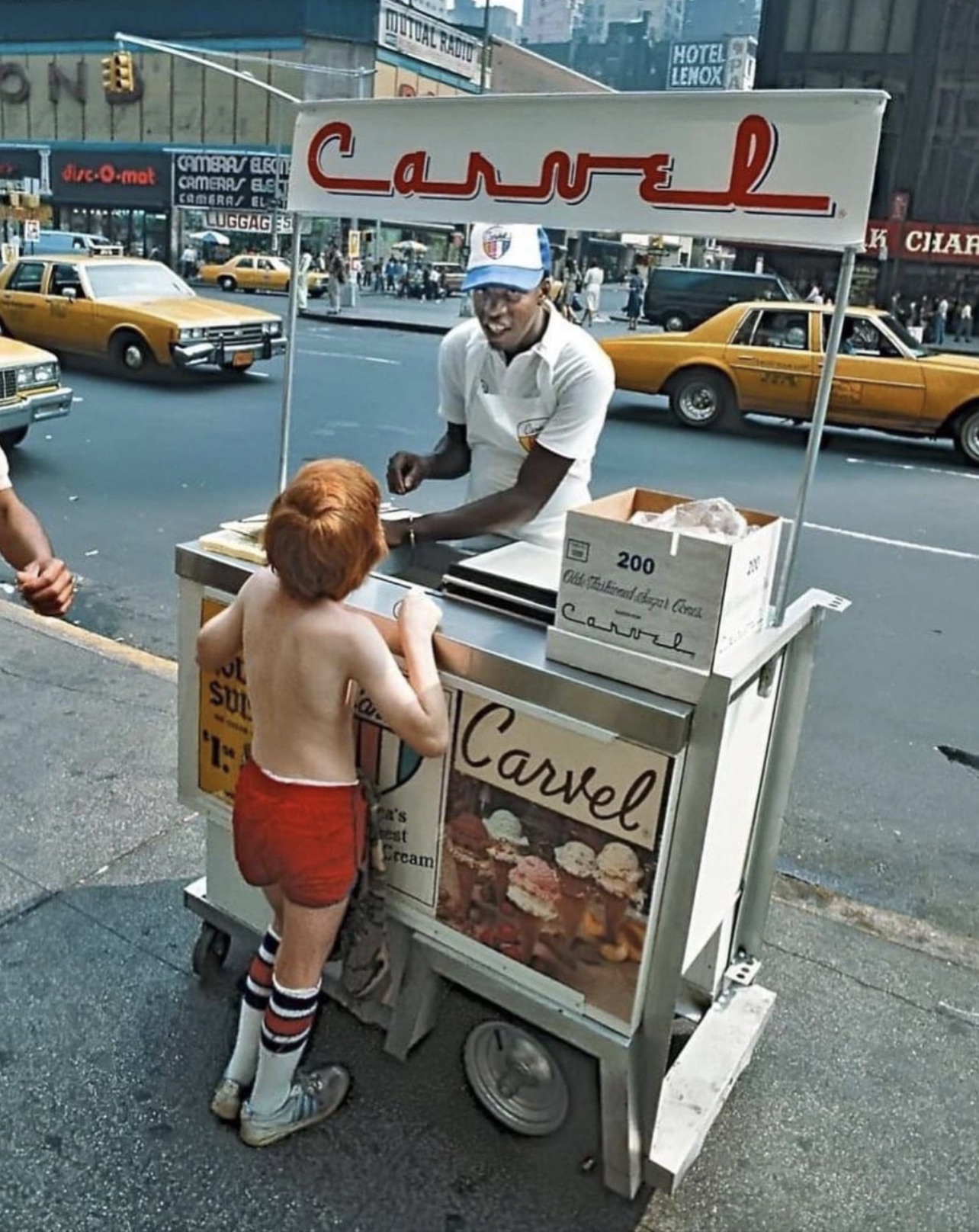 Getting some ice cream, Times Square, New York City, early 1980s 